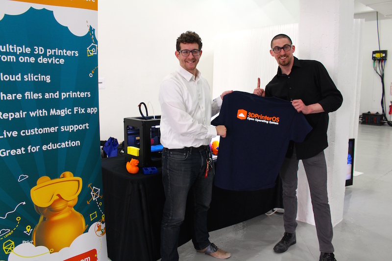 Setting up the booth was half the fun. Charles and Aaron from the 3DPrinterOS team showing off the new t-shirts.